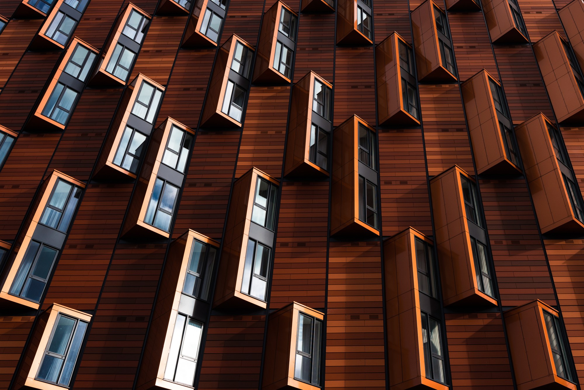 Copper-clad building with projecting glass windows